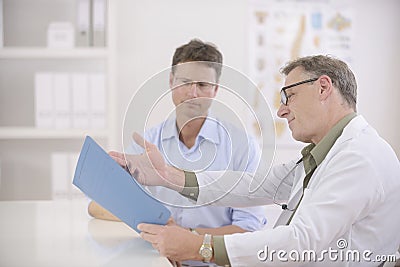 Doctor showing results to patient