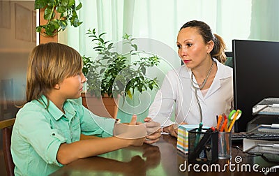 Doctor with teenage boy patient