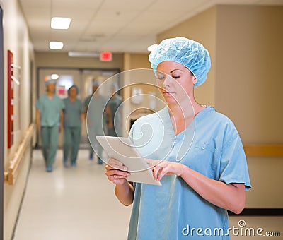 Doctor Using Digital Tablet In Hospital