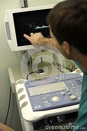 Doctor using ultrasound machine