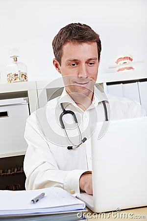 Doctor working on laptop