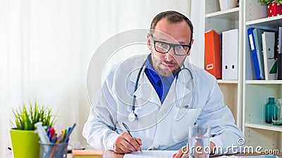 Doctor writing a prescription.