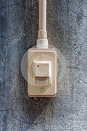 Doorbell ring on concrete wall