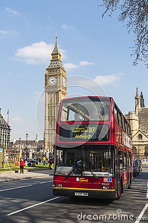 Double-decker bus driving by Big Ben