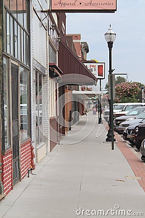 Downtown Fremont, Nebraska, Sidewalk with shops and signs and cars