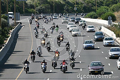 Dozens of motorcycle riders