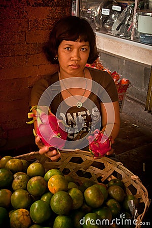 Dragon fruit and orange seller