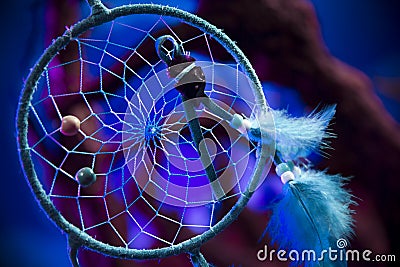 Dream catcher on a forest at night