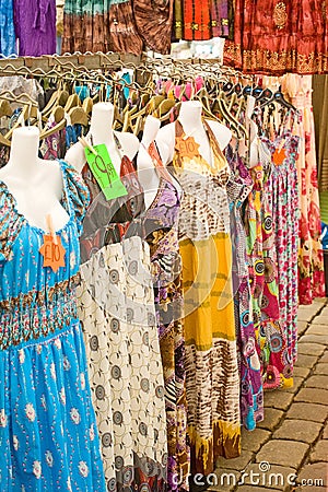 Dresses on market stall.
