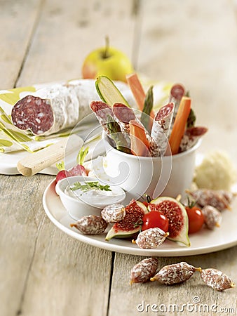 Dried sausage and raw vegetables with creamy dip