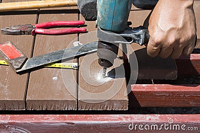 Drill setting screws in artificial wood for patio