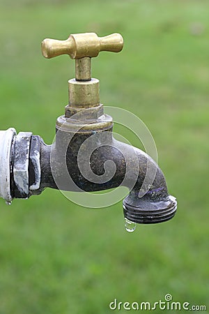 Faucet dripping close-up