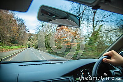 Driving car. Driver s hand on a steering wheel of a car