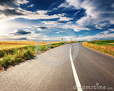 Driving on an empty asphalt road at sunny day