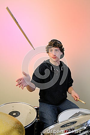 Drummer with stick in air