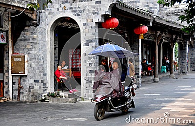 Dujiangyan, China: Woman Riding Motorcycle