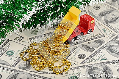 Dump truck and new year toys on the dollars background