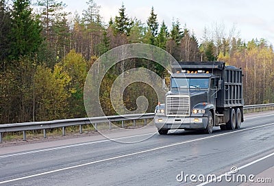 Dump truck on road of