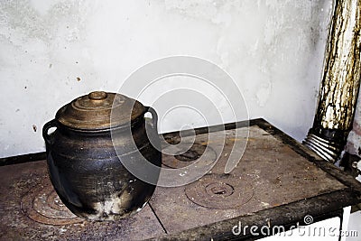 Earthen jar on the old stove