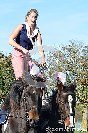 East Anglia Equestrian Fair Horse gymnastic woman on two horses