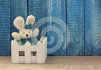 Easter background with toy rabbit