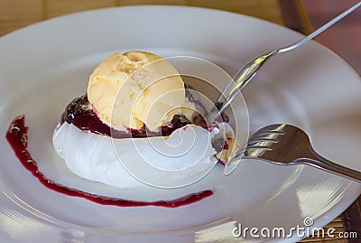 Eating dessert ice cream vanilla with jam