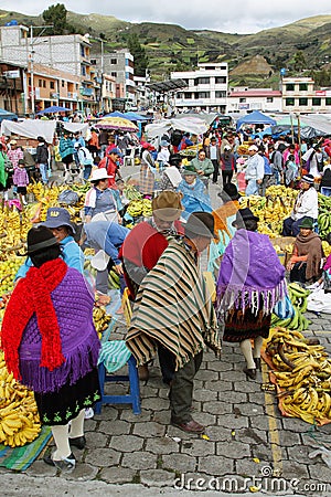 Ecuadorian ethnic people with indigenous clothes in a rural Saturday market in Zumbahua village, Ecuador.