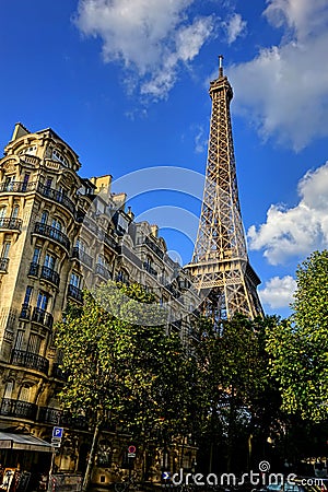 Eiffel Tower above Old Paris Neighborhood Building