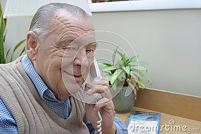 Elderly businessman on phone