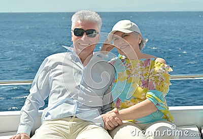 Elderly couple have a ride in a boat