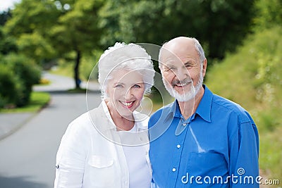 Elderly couple standing in a rural road