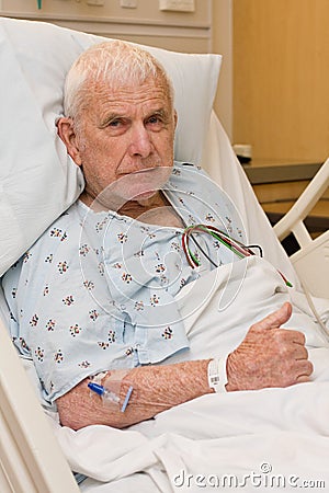 Elderly hospital patient in bed