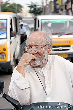Elderly indian in traffic jam