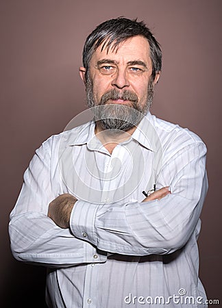 Elderly man on a brown background