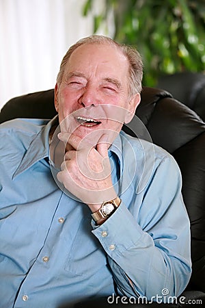 Elderly man laughing