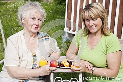 Elderly woman with adult daughter