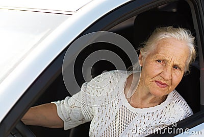 Elderly woman in the car