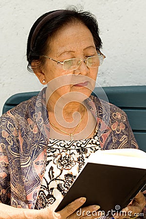 Elderly woman read book