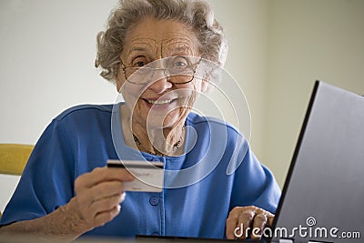 Elderly woman shopping online