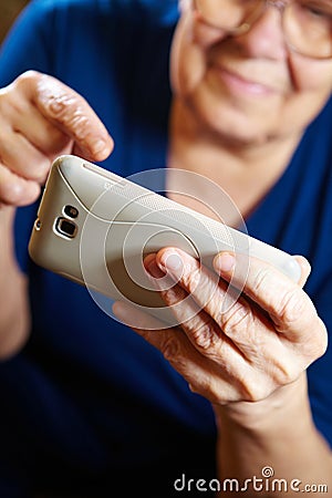 Elderly woman with tablet computer