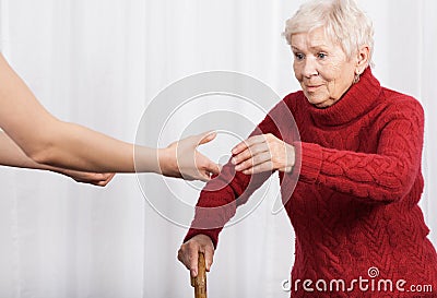 Elderly woman trying to walk