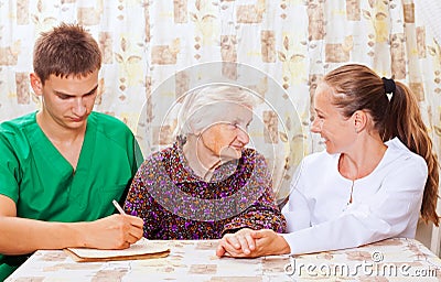 Elderly woman with the young doctors