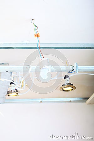 Electrical installation at construction site. Installing energy light