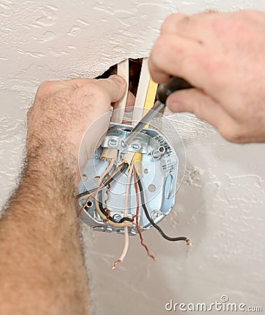 Electrician Attaching Ceiling Box