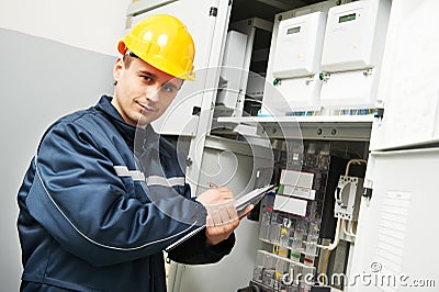 Electrician inspector checking electric meter data