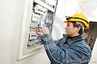 Electrician installing energy saving meter