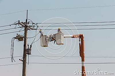 Electricians on a crane