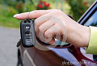 Electronic Car Key Remote in Female Hand
