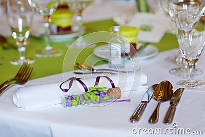 Elegant table set in lilac and green for wedding or event party