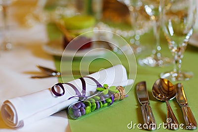 Elegant table set in lilac and green for wedding or event party